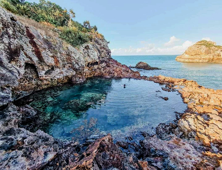 Two people swimming in Cape Hillsborough Rockpool