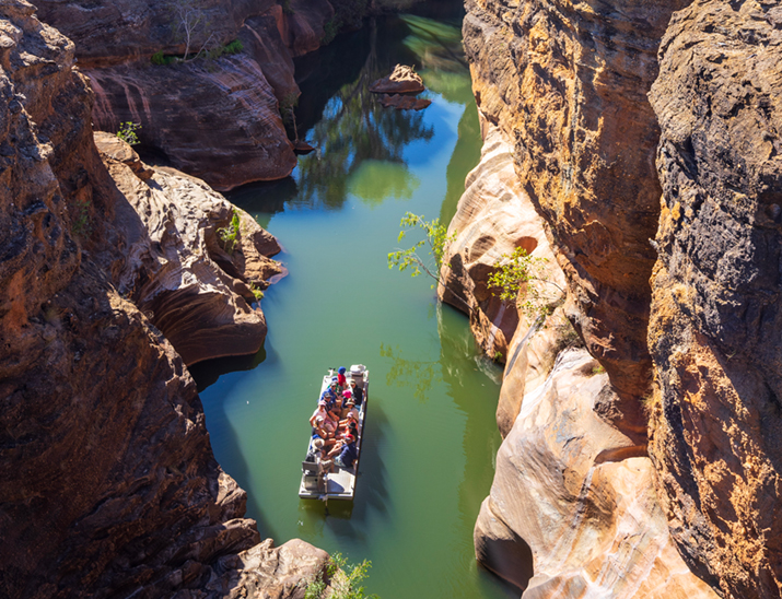 A boat full of travellers making their way up Cobbold Gorge