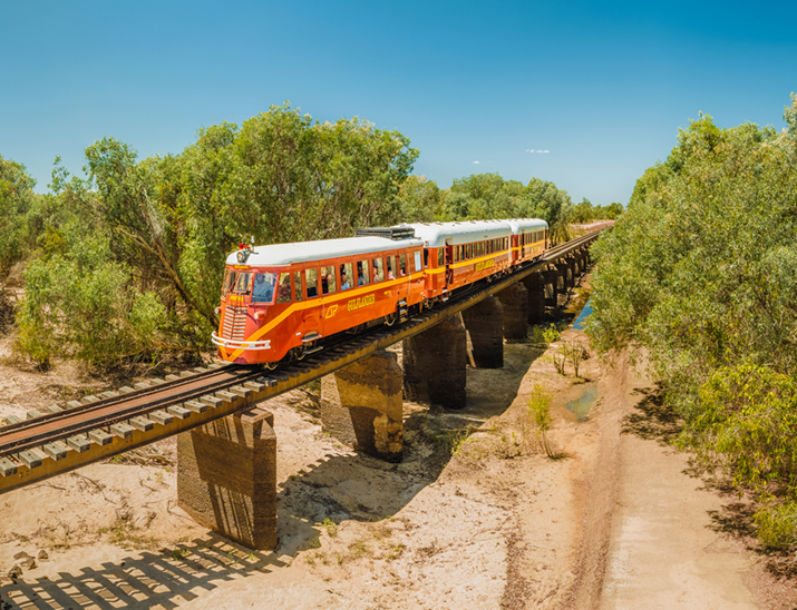 The Gulflander travels over a rail bridge in Savannah country