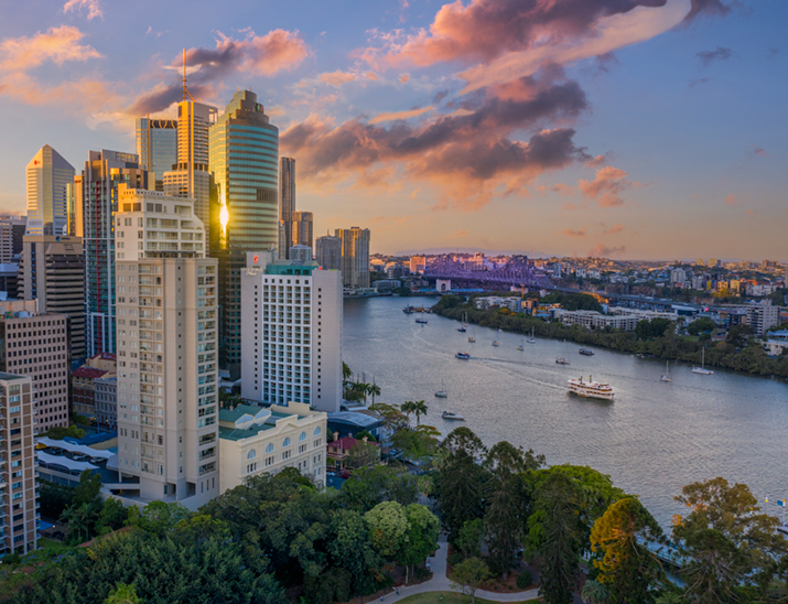 A view of Brisbane city skyline along the Brisbane River with the Storey Bridge behind