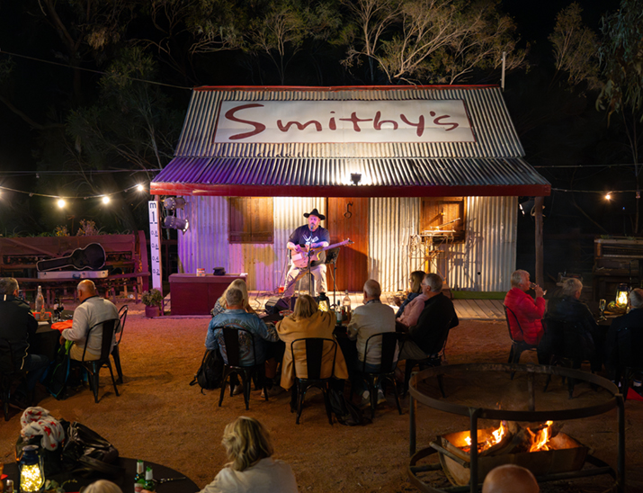 A live musical performance in front of customers  on an outdoor stage