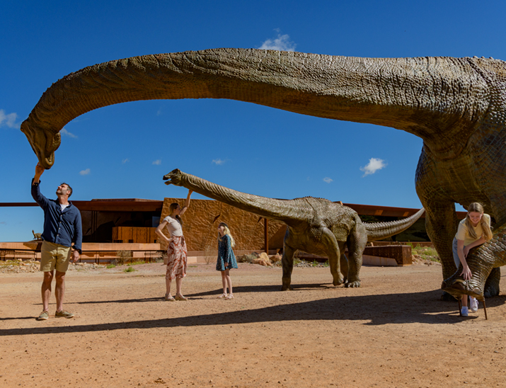 A family enjoying the dinosaur displays at the australian Age of Dinosaurs